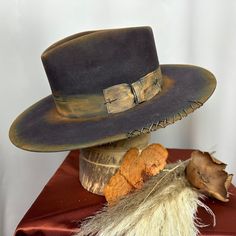 *PRICE INCLUDES $15 HAT BOX* Premium Wool Felt  4 1/4 Crown, 3 3/4 inch brim Custom Color, Distressing, Band and Accessories Colors may vary slightly. Although each hat is unique a similar hat can be made in various sizes.  Size Chart Small - 6 7/8  Medium - 7 1/8 Large - 7 3/8 XL - 7 5/8 XXL- 7 3/4 All Sales Final Distressed Felt Hat, Flat Brimmed Hat Women, Custom Cowboy Hats, Wide Brim Felt Hat, Custom Made Hats, Midnight Rider, Mens Hats Fashion, Women Hats Fashion, Distressed Hat