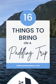 a kayak with the words 16 things to bring on a paddling trip in blue and white