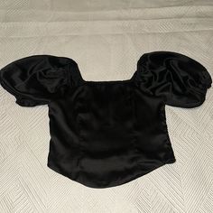 Black Satin Crop Top With Puffy Sleeve Never Worn Black Fitted Crop Top For Party, Chic Black Fitted Crop Top, Elegant Black Short Sleeve Crop Top, Fitted Black Blouse For Summer, Black Short Sleeve Crop Top For Evening, Black Fitted Evening Crop Top, Fitted Black Crop Top For Evening, Black Fitted Top For Evening, Black Fitted Evening Top