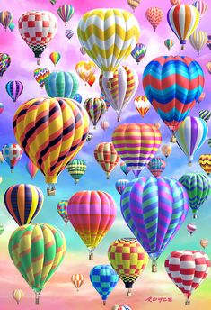 many colorful hot air balloons flying in the sky