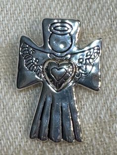 This adorable vintage silver plated Angel holding a heart is a pin, or brooch, or can be hung on a necklace as a pendant. It measures 1.5" x @1" and is in great shape. It's perfect for the holidays for you or as a gift. Enjoy! Holding A Heart, Vintage Angel, Pin Badges, A Heart, Vintage Silver, Heart Pendant, Brooch Pin, Silver Plated, Angel