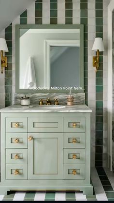 a bathroom with green and white striped walls