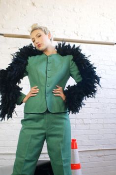 Upcycled 1950's Vintage Suit With Feather SleevesMeasurements: jacket: shoulders-36'', chest-32'', waist-28''', length-24'', underarm to sleeve length-23''  pants: waist-26'', hips-39'', inseam-26'' Fits sizes S(US) please check the measurements above and our size chartPerfect Condition100% wool, 100% upcycled goose feathersVintage (made in the USA) from the early 1950'sRevamped by ULTRA-CAT in California Fitted Feather Trim Blazer For Winter, Winter Fitted Blazer With Feather Trim, Fitted Winter Blazer With Feather Trim, Fitted Feathered Formal Outerwear, Fitted Blazer With Feather Trim For Winter, Fitted Feathered Outerwear For Spring, Fitted Feather Trim Outerwear For Evening, Vintage Fitted Outerwear For Costume, 1950s Style Fitted Vintage Outerwear