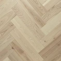 an image of wood flooring that looks like herringbones