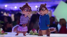 two chipmuns dressed in glasses standing next to each other on a table with people behind them