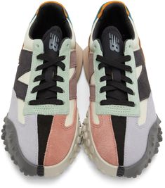 Low-top paneled canvas and suede sneakers colorblocked in multicolor. Round toe. Lace-up closure in black. Logo bonded in grey at padded tongue. Padded collar. Suede logo appliqué in black and purple at sides. Textured rubber trim in brown at heel counter. Foam rubber midsole in taupe. Treaded rubber outsole in grey. Supplier color: Bone/Black New Balance Clothing, New Balance For Women, New Balance Outfit, Color Bone, Black And Purple, Suede Sneakers, Black Logo, Luxury Streetwear, Low Top