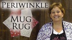 a woman standing in front of a wooden wall with the words periwinkle mug rug on it