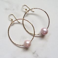 Gold Hoop Pearl Earrings~ These elegant gold hoop earrings with pink Edison pearls will look great for any occasion. Hammered and polished to a beautiful shine. Hoops are approx. 1.5" Model wearing similar designs Shop~ http://www.etsy.com/shop/HanaMauiCreations?ref=pr_shop_more International buyers please read our shipping policies before ordering~ POLICIES~ https://www.etsy.com/shop/HanaMauiCreations/policy?ref=shopinfo_policies_leftnav Elegant Hammered Earrings For Wedding, Elegant Hammered Wedding Earrings, Rose Gold Jewelry With Pearl Drop, Rose Gold Pearl Drop Jewelry, Rose Gold Pearl Round Earrings, Elegant Pink Gold Hoop Earrings, Hammered Round Wedding Earrings, Elegant Nickel-free Hoop Jewelry, Hammered Hoop Earrings For Anniversary