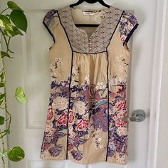 Brand New, Never Worn 100% Cotton Embroidered Tunic Dress From Gipsy India. Beautiful Lilac Purple, Red, Ivory White, And Blue Multicolor Floral Embroidery. Cap Sleeves. Button Placket Open Eyelet Front. Round Neck. Lightweight. Stylish Front Seams. Super Flattering Tag Says Size M, But Fits Like S. See Pics For Measurements. Perfect Condition, Like New, Never Worn Floral Print Tunic Embroidered Dress, Embroidered Floral Tunic Dress, Casual Embroidered Dress With Floral Print, Multicolor Embroidered V-neck Dress With Floral Print, Cream Short Sleeve Dress With Floral Embroidery, Beige Short Sleeve Embroidered Dress, Casual Beige Embroidered Dress With Floral Design, Casual Beige Floral Embroidered Dress, Casual Beige Dress With Floral Embroidery