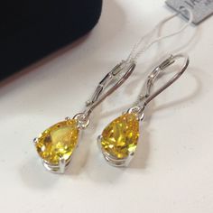 "Beautiful Canary Citrine Quartz Leverback Earrings * Pear Cut Citrine Quartz measure 9x7mm each * 3cts total Gemstone weight * Measure 1\" Long overall * Solid Sterling Silver Hallmarked & Gift Ready! Matching Pendant can be found here https://www.etsy.com/listing/254743027/beautiful-3ct-pear-cut-yellow-citrine Matching Ring Also Available! TIMELESS, BEAUTIFUL & UNIQUE FINE ART JEWELRY" Yellow Jewelry, Citrine Earrings, Matching Ring, Fine Art Jewelry, Canary Yellow, Yellow Citrine, Leverback Earrings, Matching Rings, Pear Cut