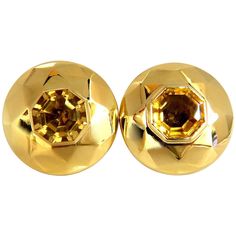 Retro Mod Dome Puff Clip 26.00ct. Natural Citrine earrings Clean Clarity, Vivid Golden yellows Octagonal step cut 12.7 X 12.8mm Diameter Earrings: 1.2 inch Depth: .50 inch 26.4 grams. 18kt yellow gold - acid tested Earrings are gorgeous made