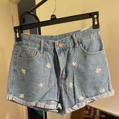 Super Cute Higher Rise Shein Jean Shorts With Cute Daisy Embroidery On The Front. Never Worn Or Washed, Too Big And Didn’t Return Reach Out With Questions Or Offers! Cute Embroidered Blue Bottoms, Casual High Waist Bottoms With Floral Embroidery, Trendy Mid-rise Bottoms With Floral Embroidery, Casual High Waist Floral Embroidered Bottoms, Casual Blue Bottoms With Floral Embroidery, Trendy Blue Bottoms With Floral Embroidery, Trendy Embroidered Blue Shorts, Cute Short-length Bottoms For Spring, Cute Short Length Bottoms For Spring