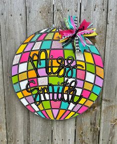 a colorful stained glass door hanger that says, let's go outside