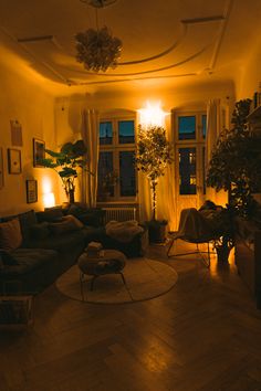 a living room filled with furniture and lots of windows