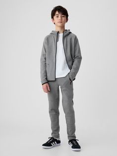 Stretch knit.  All styles with the exception of dip-dye, have gDry Moisture Wicking that helps keep your skin dry.  Drawstring ties at elasticized waist.  Front zip-slant pockets.  Seamed detailing at knees.  Easy pull-on waist.  Easy through the hip and thigh.  Tapered through the leg. Joggers Grey, Kids Jogger, Gap Fit, Dip Dye, Knit Pants, Dry Skin, Moisture Wicking, Dip, Gap