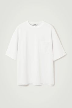 This T-shirt is a few steps up from your classic jersey tee. Weighing in at a substantial 290gsm, it's made with premium organic cotton that's hefty, warm and holds the boxy shape in place. It's designed with a mock neck, dropped shoulders and a casual patch pocket at the chest – perfect for hooking your sunglasses onto. Oversized fit, 290gsmSide slits, stepped hemOrganic cotton is grown from non-genetically modified seeds without chemical fertilizers or pesticides Shell: 70% Organic cotton, 30% White Boxy Classic T-shirt, Belted Cape, Perspective Sketch, White Tee Shirts, Genetically Modified, Modern Wardrobe, Cashmere Coat, Clothing Ideas, Jersey Tee