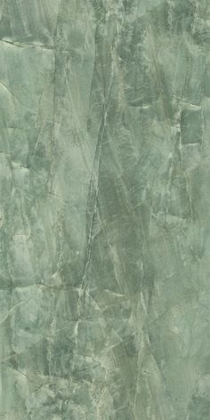 a green marble textured wallpaper with grey and white colors, as seen from above