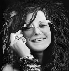 a black and white photo of a woman talking on a cell phone