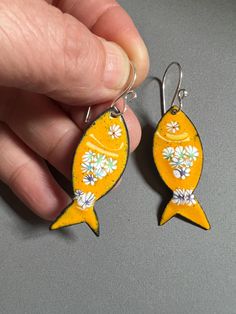 These playful fish are made by firing enamel powders to a copper blank. The flowery fin design is hand placed glass pieces fired into the yellow enamel. One Only Unique. 2 1/4 Inch Drop Length Fish Earrings, Enameled Copper, Glass Pieces, Copper Earrings, Ear Wires, Metal Art, Jewelry Earrings Dangle, 4 Inch, Dangle Drop Earrings