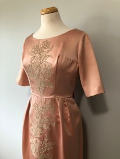 "This is a gorgeous handmade dress. The zipper needed repair so just completed that and now it's ready for a lovely lady to rock this dress somewhere!! In great condition!! Size: XS Tag - none Era - 50s Material - Satin, acetate, nylon, nylon zipper, metal snap buttons, hook and eye, cotton lace threading Bust - 32 to 34\" Waist - 25/26\" Hips - 34/35\" Arm length - (Measured under armpit to wrist hem) Length - Condition - great Washing - dry clean only or lightly steam clean" Embroidered Fitted Bridesmaid Dresses, Fitted Embroidered Bridesmaid Dresses, Fitted Embroidered Dresses For Bridesmaids, Bridesmaid Dresses With Embroidered Fitted Design, Fitted Tea Length Dresses For Mother Of The Bride, Fitted Floral Embroidered Dress For Mother Of The Bride, Fitted Floral Embroidered Tea Length Dress, Fitted Tea-length Dress With Floral Embroidery, Fitted Floral Embroidered Tea-length Dress