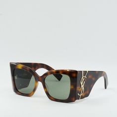 Step out in style with these Saint Laurent SLM119 BLAZE 002 sunglasses in Dark Havana/Green. These luxurious frames are the perfect accessory to elevate any outfit, whether you're hitting the streets or lounging by the pool. The Havana frame color adds a touch of sophistication, while the green lenses provide a pop of color that will make you stand out from the crowd. With a lens socket width of 53 and a bridge size of 19, these sunglasses are the perfect fit for any face shape. Saint Laurent is Designer Sunglasses With Gradient Square Frame, Designer Sunglasses With Square Frame And Gradient Lenses, Designer Brown Sunglasses For Summer, Designer Mirrored Sunglasses For Summer, Designer Cat Eye Sunglasses With Polarized Lenses For Summer, Luxury Polarized Cat Eye Sunglasses For Summer, Designer Cat Eye Tinted Sunglasses, Designer Wayfarer Sunglasses With Tinted Lenses, Designer Cat Eye Sunglasses With Mirrored Square Frame