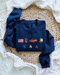 USA Embroidered Icons Sweatshirt, America Crewneck, 4th of July USA Flag Shirt, Country Western Cowboy Hoodie, Eagle, Patriotic Tee I T E M ∙ D E T A I L S * Types: Unisex T-Shirt, Sweatshirt, Hoodie * T-shirt material: 100% cotton * Solid colors are 50% cotton and 50% polyester * Sizing: S, M, L, XL, 2XL, 3XL ➤ Care Instructions: Machine wash cold. Tumble dry low or hang to dry. Wash inside out. Do not iron or dry clean. H O W ∙ T O ∙ O R D E R 1. Select the size from the first drop-down menu. Usa Embroidery Designs, Patriotic Blue Tops For Fall, Navy Cotton Hoodie Top, Patriotic Crew Neck Sweatshirt With Graphic Print, Patriotic Cotton Sweatshirt For Fall, Patriotic Long Sleeve Cotton Sweater, Patriotic Cotton Sweatshirt With Letter Print, Patriotic Long Sleeve Sweatshirt With Graphic Print, Patriotic Crew Neck Sweatshirt For Fall