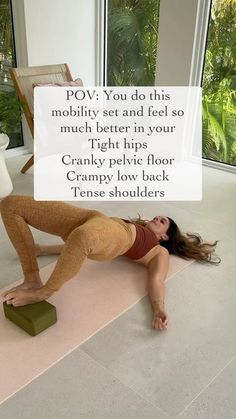 a woman laying on the ground in front of a window with a sign above her that says pov you do this mobility set and feel so much better in your thigh