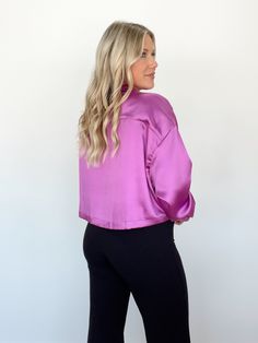 This Business Savvy Top is nothing short of luxurious! Crafted from soft and supple satin, wearing this top will ensure you look elegant and tasteful, with a touch of sophistication. The classic collared neckline, elevated with a pop of color, is accentuated with subtle button closures for a look that is both stylish and timeless. Relaxed and comfortable, this top is perfect for the office, for school, or for any event that requires a touch of class. 100% Polyester Hand wash cold separately. Trendy Satin Blouse For Spring, Sleek Solid Color Collared Tops, Feminine Satin Tops For Workwear, Feminine Satin Tops For Work, Sleek Collared Spring Blouse, Sleek Spring Collared Blouse, Sleek Collared Blouse For Spring, Solid Color Silk Tops For Spring, Solid Silk Tops For Spring