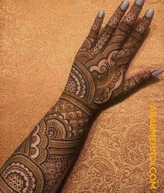 henna tattoo on the arm and hand