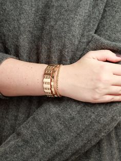 Calling all gold lovers! These gold tone stretch bracelets are the perfect statement for those who love to stack 'em up! Detailed in gold tone beads. Sold as a set of three. Measures approximately 2" x 2" inner diameter. Golden Rule, Stretch Bracelets, Gold Tones, Beads, Gold