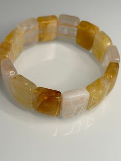 The Golden Healer Bangle, with its 17mm  square soft design, offers several benefits: Size: 17CM - Facilitates spiritual growth and inner transformation. - Promotes healing on all levels - physical, emotional, and spiritual. - Enhances clarity of thought and intuition. - Supports overall well-being and vitality. Its soft bangle design ensures comfortable wear while harnessing the powerful healing energy of the golden healer crystal. Inner Transformation, Golden Healer Quartz, Bangle Design, Golden Healer, Soft Design, Bangle Designs, Crystal Points, Spiritual Growth, Gemstone Bracelet