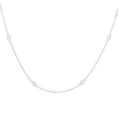 A staple in any jewelry collection this necklace features round brilliant cut diamonds in bezel stations. Classic Necklace With Smooth Bezel, Classic Cubic Zirconia Tennis Necklace With Bezel Setting, Classic Diamond White Necklace With Bezel Setting, Classic White Gold Necklace With Smooth Bezel, White Gold Diamond Necklace With Smooth Bezel, Timeless Diamond White Necklaces With Bezel Setting, Luxury Cubic Zirconia Solitaire Necklace With Bezel Setting, Formal Diamond Necklace With Smooth Bezel, Dainty Cubic Zirconia Necklace With Bezel Setting