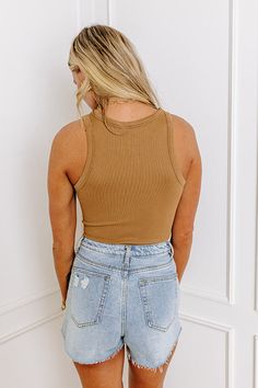 - When it's a messy bun and coffee run kind of day stay looking stylish with this trendy bodysuit! - Stretchy material with a subtle ribbed texture - A crew cut neckline - A zip-up front that begins at the waistline - A sleeveless cut - A figure flattering fit that ends in cheeky cut bottoms with hook and eye closure Casual Brown Bodysuit, Brown Ribbed Crop Top For Spring, Spring Ribbed Brown Crop Top, Casual Ribbed Bodysuit For Spring, Brown Ribbed Tank Top For Spring, Trendy Ribbed Brown Tank Top, Trendy Brown Ribbed Tank Top, Trendy Brown Ribbed Crop Top, Spring Brown Ribbed Tank Top