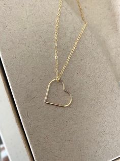 This simple, dainty 14k gold filled floating open heart necklace can be customized to your preferred length.  It's simply suspended from delicate 14k gold filled chain finished with a lobster claw clasp.  The heart is a great size, not too small and not too big at 17.5mm.  A wonderful handmade jewelry gift for bridesmaids, best friend, anniversary or a special woman on any occasion! You may also like to check out more of my necklaces here: http://etsy.me/2kMdyB0 Free first class USPS shipping wi 14k Gold Heart Necklace With Delicate Chain For Gift, 14k Gold Open Heart Necklace For Gift, Dainty 14k Gold Open Heart Necklace, 14k Gold Filled Heart Pendant Necklace As Gift, Rose Gold Open Heart Charm Necklace With Delicate Chain, Minimalist 14k Gold Filled Necklaces With Heart Charm, Minimalist 14k Gold Filled Heart Pendant Necklace, Everyday Gold Heart Necklace 14k Gold Filled, Minimalist 14k Gold Necklace For Valentine's Day