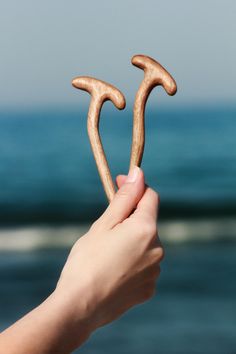 This beautifully handcrafted wooden hair pin features a sleek and minimalist design, perfect for securing your hair with style and comfort. Made from either light ash wood or dark walnut, the natural beauty of the wood shines through, adding a touch of elegance to your hairstyle. The finely sanded surface ensures a smooth, soft texture, providing a firm yet gentle hold that won't damage your hair. Whether for everyday wear or special occasions, this hair pin is a timeless accessory that complements any look with its natural and elegant charm. Hair Accessories Bun, Your Hairstyle, Timeless Accessories, Dark Walnut, Hair Pin, Ash Wood, Soft Texture, Soft Textures, Hair Pins