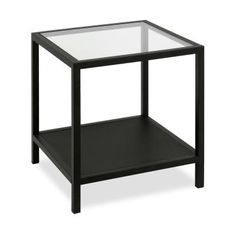 a black table with a glass top and shelf on the bottom, against a white background