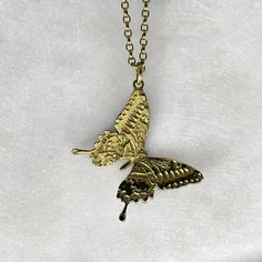 In a world of change, butterflies are always there to remind you that everything is going to be alright. The perfect accessory for those who believe in living life with joy and positivity.  Solid 24k gold plated 925 sterling silver etched butterfly pendant on a selection of 925 gold plated silver chain. Pendant measures 2.5cm in width. Picture shows 16" / 18" chain. 925 Sterling Silver, 24k Gold Plate. Handmade to order in the Jewel Thief Brighton atelier. Sterling Silver Yellow Gold Butterfly Pendant Necklace, Yellow Gold Pendant Jewelry With Butterfly Clasp, Sterling Silver Yellow Gold Butterfly Necklace, Yellow Gold Sterling Silver Butterfly Necklace, Nature-inspired Butterfly Charm Necklaces, Butterfly Charm Pendant Jewelry Gift For Her, Gold Butterfly Engraved Jewelry, Yellow Gold Butterfly Charm Jewelry, Butterfly Charm Jewelry Gift