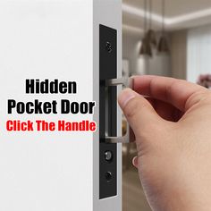 a hand is holding the door handle on a pocket door that says,'hidden pocket door click the handle '