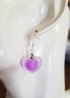 New Stunning Purple Frosted Glass Heart Earrings ♡ These beautiful frosted glass puff heart earrings with a purple heart core are sure to get you compliments. ♡ Dangle length measures just under 1.25 inches ♡ .925 sterling silver ear hooks ♡ Lightweight ♡ Ships within 24 hours of purchase Monday-Saturday Purple Heart-shaped Earrings For Pierced Ears, Purple Heart-shaped Pierced Earrings, Purple Heart Earrings With Heart Charm, Purple Heart Charm Earrings For Valentine's Day, Purple Heart Beads Earrings For Gift, Heart Core, Purple Heart Earrings, Dangle Earrings Silver, Orange City