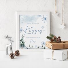 a white framed poster with the words sweets and treats next to christmas presents on a table