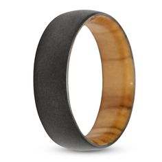 a wedding ring with an animal's eye in the center and black ceramic inside