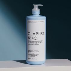 Bottle of clarifying shampoo in a liter bottle with a pump in front of a deep blue background Detox Shampoo, Hard Water, Deep Cleansing, Active Ingredient, How To Know