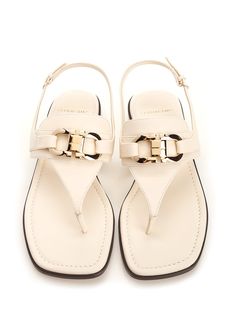 'Lula' thong sandal by Ferragamo, in white leather with double Gancini detail and flat sole. Composition: upper: 100% calf lining: 100% lamb sole: 100% bos taurus. Luxury Slingback Sandals With Leather Footbed For Summer, Luxury Summer Slingback Sandals With Leather Footbed, Luxury Leather Footbed Slingback Sandals For Summer, Elegant Flat Heel T-strap Leather Sandals, Elegant Leather T-strap Sandals With Flat Heel, Elegant Beige Flat Sandals, Chic T-strap Sandals With Removable Insole And Toe Post, White Flat Heel T-strap Sandals With Buckle Closure, White Leather Toe Post Sandals