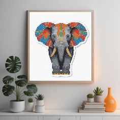 an elephant made out of different colored beads on a white wall next to potted plants