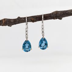 Teardrop London Blue Topaz in 14K Solid Gold w Natural Diamond Accents | Pear Shape 10x7mm | Secure Latch Back | Dangle Earrings | Blue Gems Teardrop Blue Topaz Earrings, Elegant Teardrop Blue Topaz Earrings, Elegant Blue Topaz Teardrop Earrings, Blue Topaz Earrings, Topaz Earrings, Blue Gems, Earrings Blue, Natural Earth, London Blue Topaz