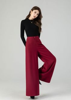 "Discover contemporary winter chic in our burgundy wide-leg high-waisted wool pants. Crafted with care from luxurious wool, these full-length trousers offer the ultimate combination of fashion and warmth. Their wide-leg silhouette adapts to various occasions, and the deep wine-red shade radiates timeless elegance. Whether you're headed to work or a festive event, these wool pants ensure you're both stylish and cozy. DETAIL * 30% wool blend, 40% fiber and polyester, 40% nylon * Full polyester lining * Two side pockets * Zipper and button front closure * Wide leg pants * High waisted Pants * Perfect for summer, autumn and spring * Dry clean MODEL SIZE Bust 85 cm(33.4\") Waist 67 cm(26.7\") Height 168cm (5' 6\") She wears size XS Choose CUSTOM Order if you * Need a better fit * Can't find you Wine Red Trousers Outfit, Red Pants Black Top, High Waist Trousers Women, Burgundy Work Pants Outfit, Red Wine Pants Outfit, Wine Red Pants Outfit, High Waist Pants For Women, Wide Leg Red Pants Outfit, Elegant Trousers Outfit