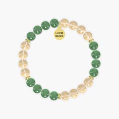 This bracelet named Success Manifestation combines the vibrant energy of Citrine with the soothing properties of Aventurine. Citrine, known as the 'merchant's stone', is associated with success, prosperity, and abundance. Its sunny yellow color promotes positivity and motivation, helping to manifest goals and dreams. Aventurine, with its calming green hues, is believed to attract luck and opportunities while enhancing creativity and confidence. Together, these gemstones create a harmonious blend Gold Agate Crystal Bracelet For Healing, Gold Jade Crystal Bracelet With Spiritual Style, Gold Jade Crystal Bracelet Spiritual Style, Gold Jade Crystal Bracelet, Spiritual Style, Gold Jade Crystal Bracelet With Natural Stones, Everyday Spiritual Aventurine Bracelets, Holistic Gold Bracelets With Natural Stones, Gold Aventurine Bracelets As Gift, Gold Aventurine Beaded Bracelets