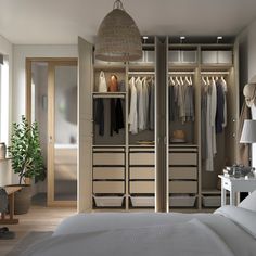 a bedroom with an open closet and bed