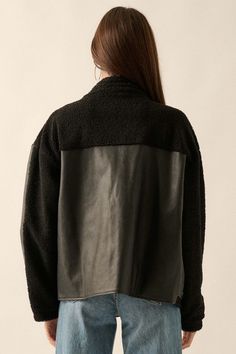 Faux leather mixed media jacket. Faux shearling accents throughout. Collared neckline. Zip-up front closure. Decorative button closure. Side pockets. Buttoned flap chest pockets. Long sleeves. Drop shoulder. Yoke back. Lined. Relaxed fit. 50% Polyester, 50% PU. Imported. Designed in LA. Model wears size S. Text Codes, Sherpa Trucker Jacket, Black Faux Leather Jacket, Big Rig, Faux Leather Jacket, Leather Jacket Black, Vintage Canvas, Clothes Horse, Trucker Jacket