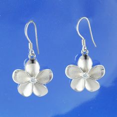 Silver Jewelry,  Silver Earring,  Silver Plumeria Earring, Hawaiian Plumeria, Plumeria Earring, Flower Earring, Silver Plumeria, Hawaii Flower, Hawaii Lei, Hawaiian Jewelry, Hawaiian Earring, Hawaiian Flower Sterling Silver Plumeria Dangle Earring Stamped: 925 Silver Metal: Genuine 925 Sterling silver Earring Width: 18 mm Earring Height (Including Ear Wire) :  33 mm Finish:  Sand Finish with High Polish on the edges This earring arrives in a beautiful gift box. SKU: W4028 The Hawaiian plumeria f Hawaii Lei, Hawaii Necklace, Flower Hawaii, Hawaiian Bracelets, Hawaiian Necklace, Hawaiian Plumeria, Hawaii Jewelry, Hawaiian Flower, Hawaiian Jewelry